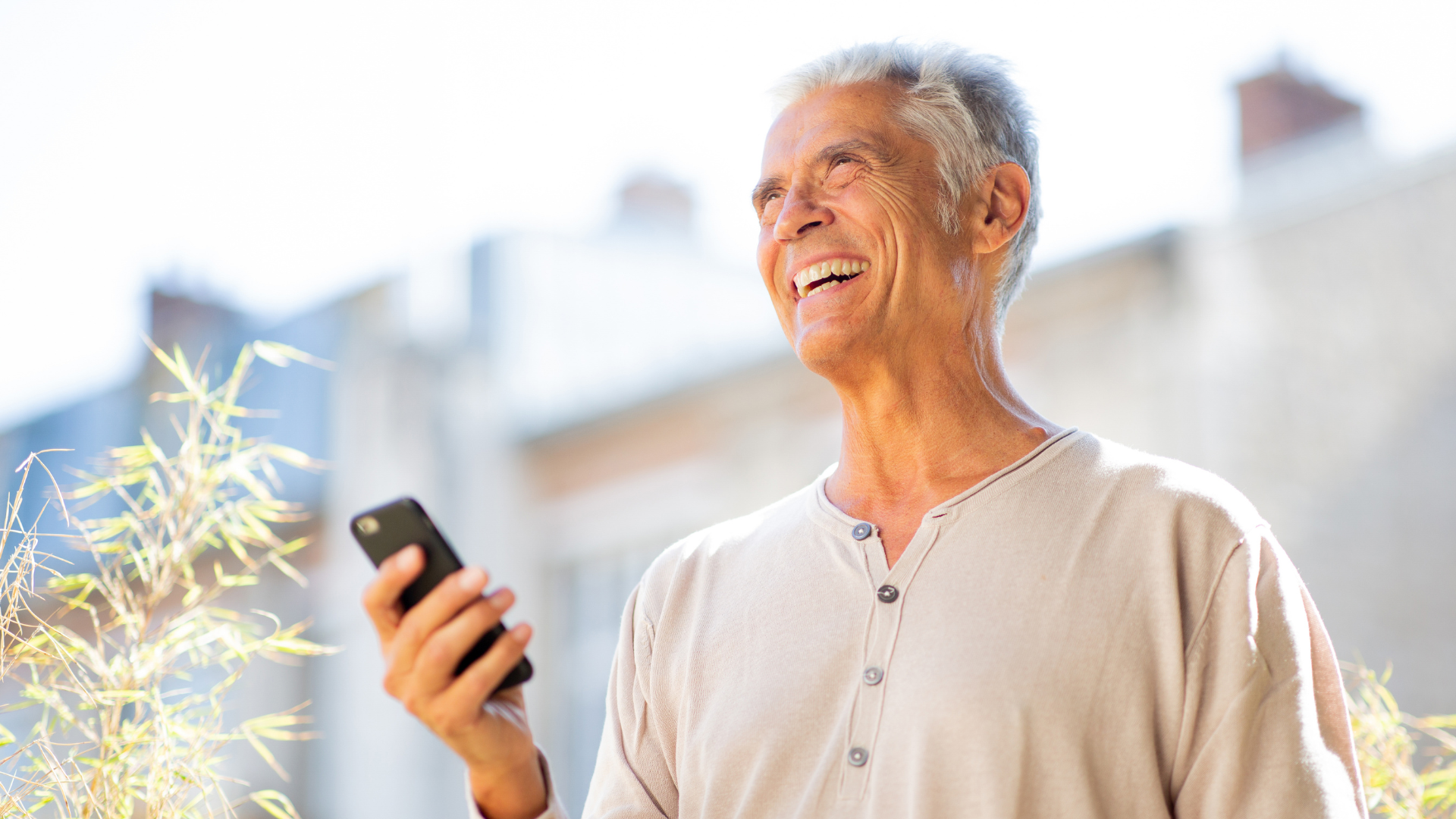 Senior user smiling while using Nomi