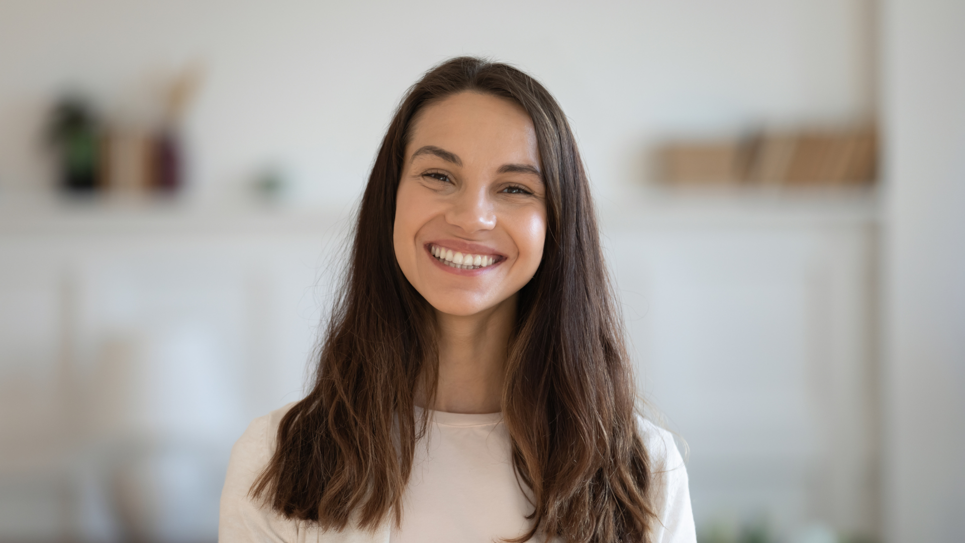 Sarah smiling at home